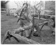 Photograph: Man sawing wood by hand