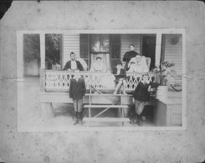 [Group of people on the porch of a home.]