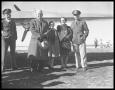 Primary view of Lt Chapman & family with "Flying Fortress Plane".