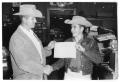 Primary view of [Former Childress County Agent Chile Smith and 4-H Member Larry Murphy]