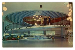Postcard of a winding staircase in a lobby