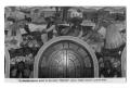 Thumbnail image of item number 1 in: 'Postcard of a mural above an entryway'.