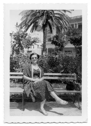 [Photograph of Marie Burkhalter Sitting on Bench]