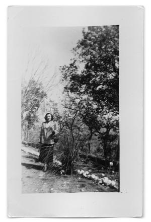 [Photograph of unidentified woman in the wilderness]