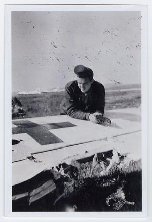 [Photograph of Bill Bondurant Looking at Damage to Wing]