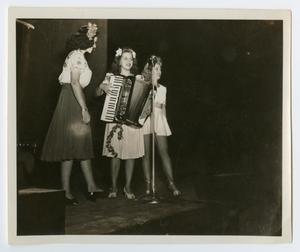 [Photograph of Three Women Performing]