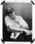 Thumbnail image of item number 1 in: 'Charles Delphenis holding his baby son Ray'.