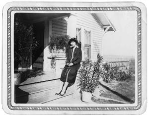 Woman on the steps of a house