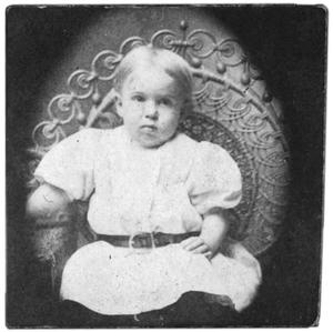 Portrait of a child in a white outfit