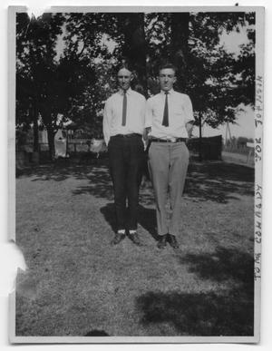 Joe L. Johnson and Thomas Conrady in the yard of a house