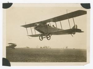 Primary view of object titled '[Biplane taking off]'.