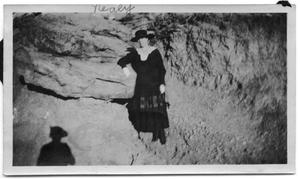 Neely Scrivner standing on the side of a rock face
