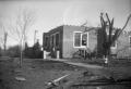 Photograph: [Photograph of House and Debris After Tornado]