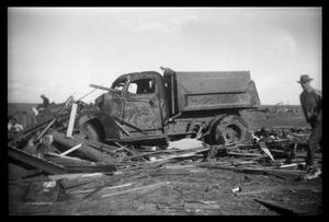 [Photograph of Man and Damaged Truck]