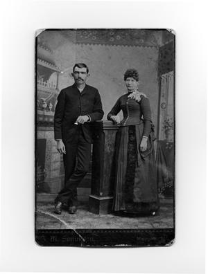 Primary view of object titled 'Couple in Nice Clothes with Podium'.