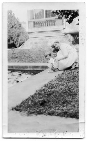 Carrie Brown with E.W Brown III and John S. Brown next to a pool
