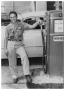Photograph: [Attendant at a Humble Gas Station]