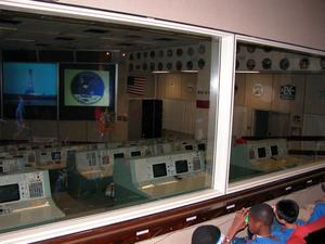 Primary view of object titled '[Kids Looking into Mission Control Room]'.