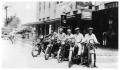Photograph: [Gulf Station Men on Motor Bikes]