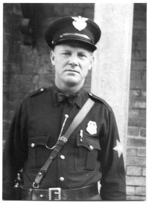 J.M Morgan in a police uniform