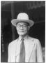 Photograph: K. Kish in a white suit and hat