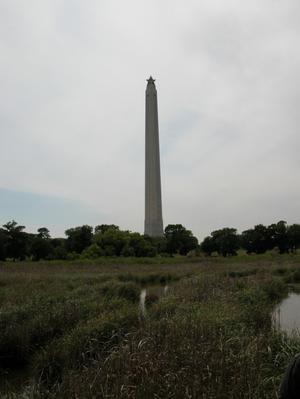 Primary view of object titled 'San Jacinto Monument with bayou in foreground'.