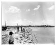 Primary view of [Photograph of Sandbags Along the Flooded Sabine River]