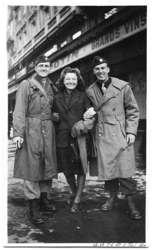 Mary Ann Petsche with two uniformed men  in Paris