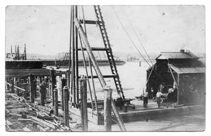 Primary view of object titled 'Barges, Boats, and Logs on Waterfront'.