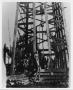 Primary view of [Men Standing on an Oil Derrick]