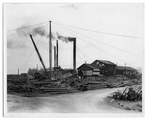 Primary view of object titled '[Lumber yard and derrick]'.
