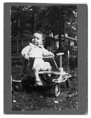 [Baby in toy car]