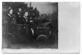 Photograph: [Three people seated in a car prop]
