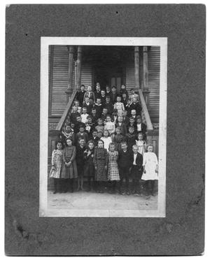 [Group of children posed on steps]