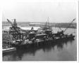 Photograph: [Barges and Oil Derricks]