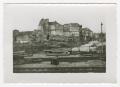 Primary view of [Photograph of Ruined Buildings by Railroad Tracks]