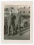 Photograph: [Two Soldiers Standing by a Car]