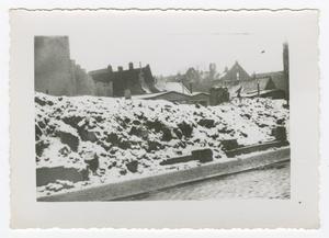 Primary view of object titled '[Photograph of Snow Covered Rubble]'.