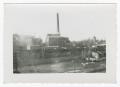 Photograph: [Photograph of a Ruined Building with a Smokestack]