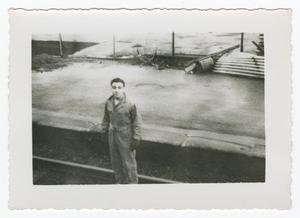 [Photograph of a Man Standing on a Road]
