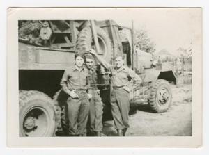 [Three Soldiers Posing by a Truck]