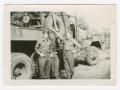 Photograph: [Three Soldiers Posing by a Truck]