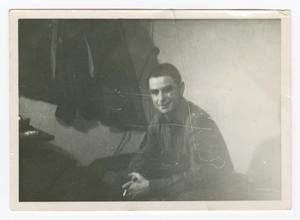 Primary view of object titled '[Photograph of a Sitting and Smiling Soldier]'.