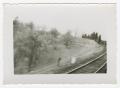 Photograph: [Railroad Tracks Along the Base of a Hill]