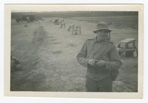 [Photograph of a Soldier on a Field]