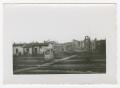 Primary view of [Photograph of Destroyed Buildings Behind Railroad Tracks]