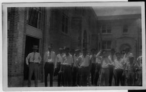 [Group men standing in front of building-unidentified]