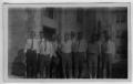 Primary view of [Group men standing in front of building-unidentified]