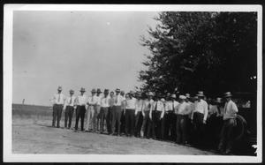 Primary view of object titled '[Group of Men Standing Under a Tree and Next to an Automobile]'.