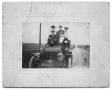 Photograph: [Group in vehicle]